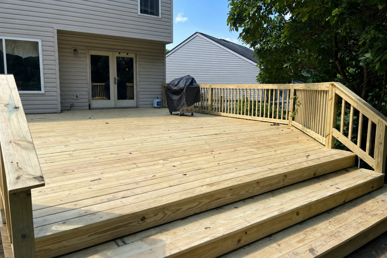 Pressure-treated wood deck construction
